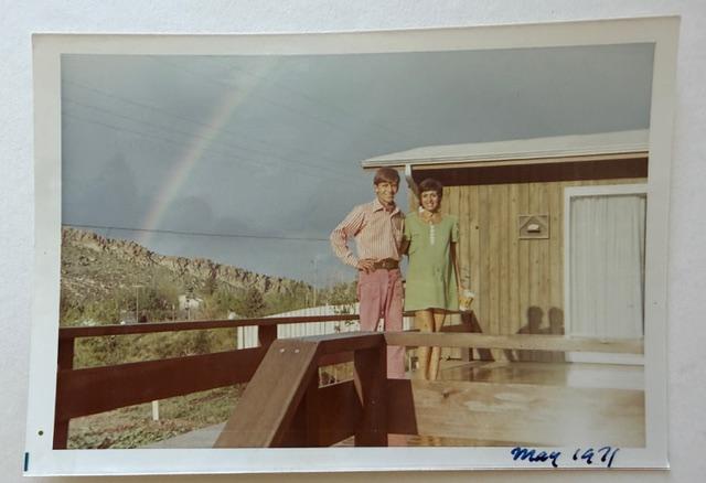 Rolf and Ginny Paul at their home in Morrison in May 1971 with a rainbow over the red rock canyon behind them.