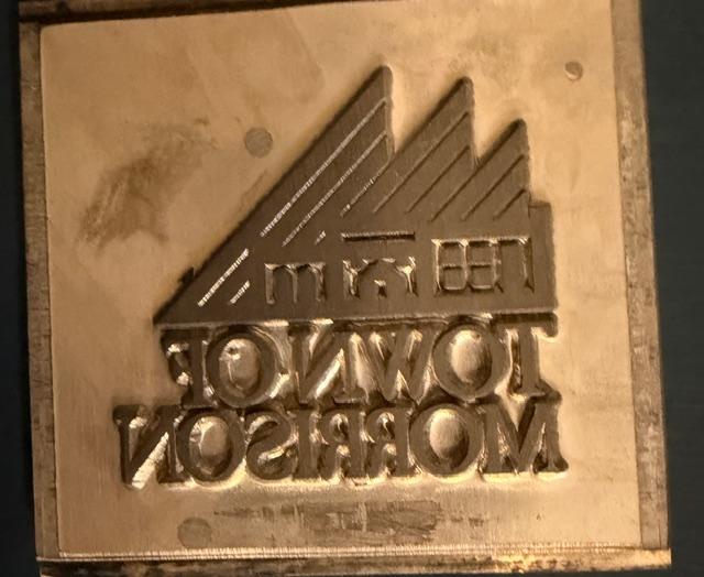 Original metal die cut of the Town of Morrison logo