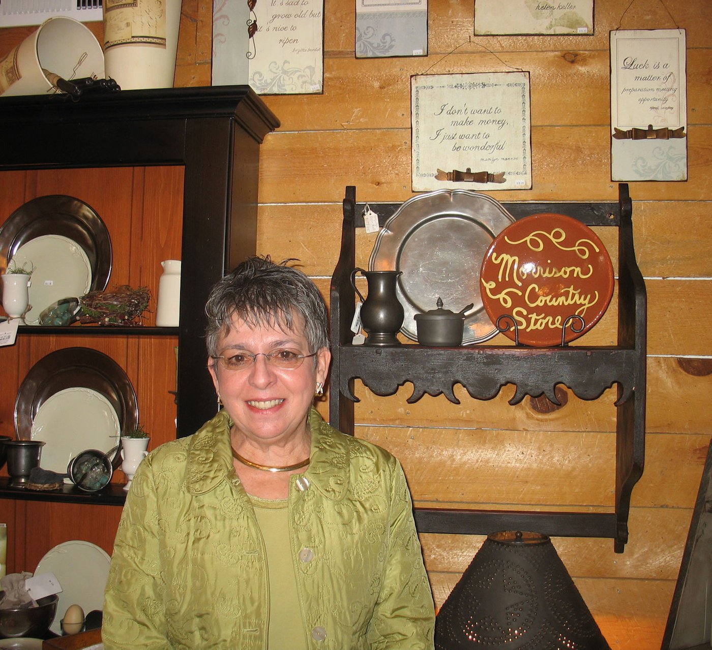 Ginny Paul inside the Morrison Country Store near redware and pewter.