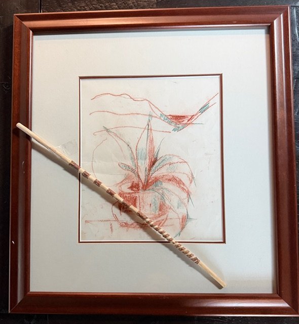 Rolf’s final sketch — a red-rock-hued drawing of the plant on his desk overlooking the hogback, with a whittled twig tucked into the frame